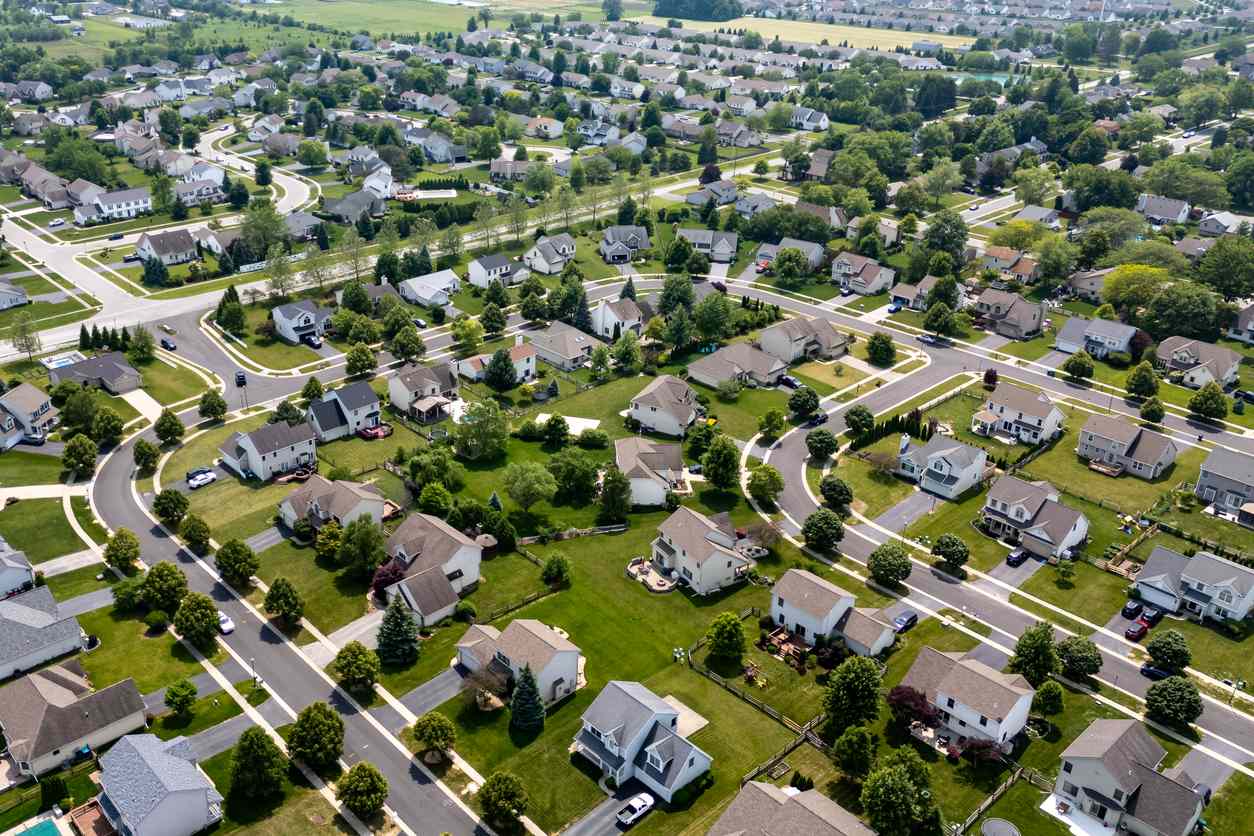 A residential suburban neighborhood with houses on plots of land